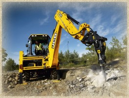 Услуги гидромолота. Гидромолот на экскаваторе-погрузчике JCB.