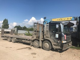 Аренда, манипулятор-эвакуатор грузовой Hino Profia (гр/п 12 т, трал с гидравлическими аппарелями для заезда техники и лебедкой гр/п 20 т)