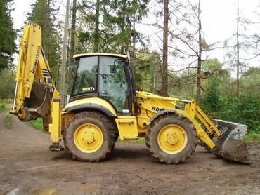 Услуги челюстного экскаватора-погрузчика KOMATSU WB 97
